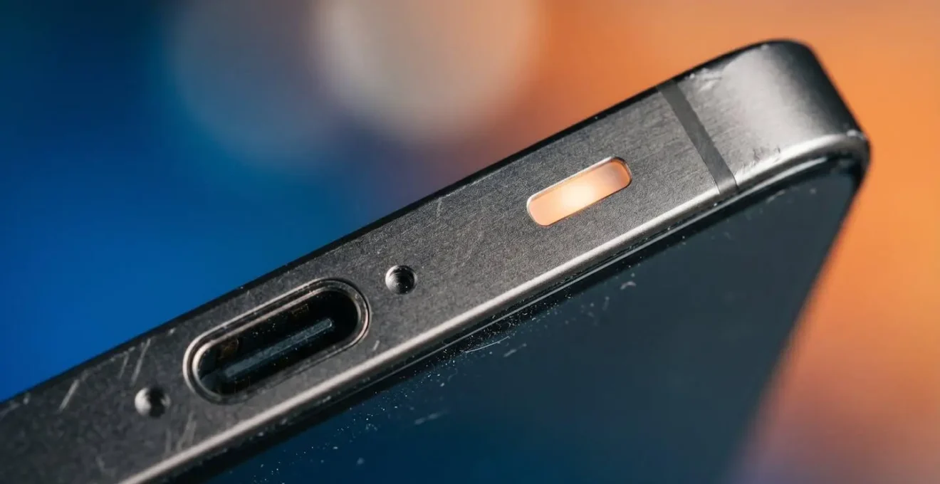 Close-up detail showing smartphone battery indicator and power consumption visualization concept