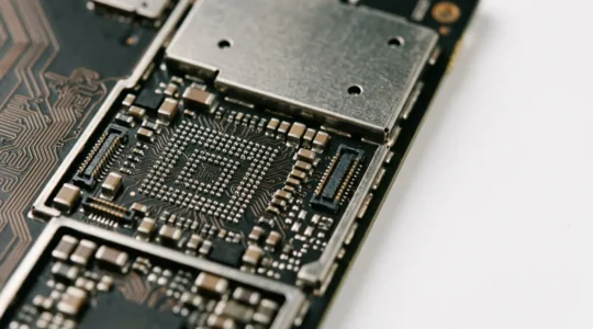 Close-up view of smartphone internal components showing delicate circuit board and hardware elements