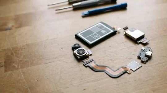 Modular smartphone components arranged to illustrate sustainable repair practices